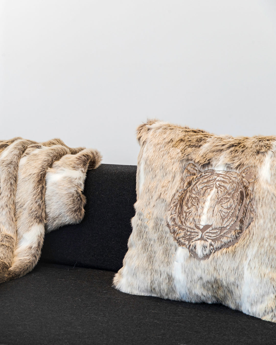 Embroidered faux fur cushion brown